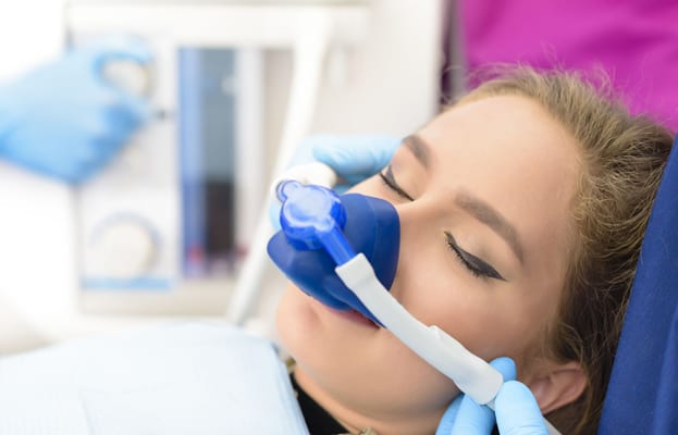 Nitrous oxide is administered to Female patient for sedation dentistry at Perspective Dental