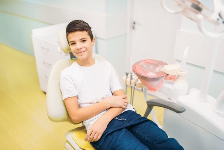 Boy In A Dental Chair for a preventative checkup and dental cleaning at Perspective Dental